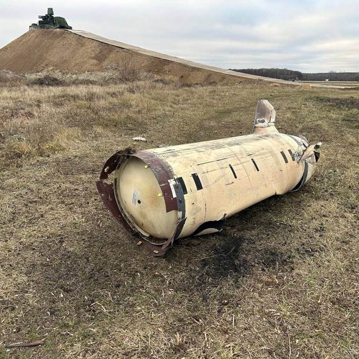 A damaged missile lies in a field in Russian territory near Ukraine.